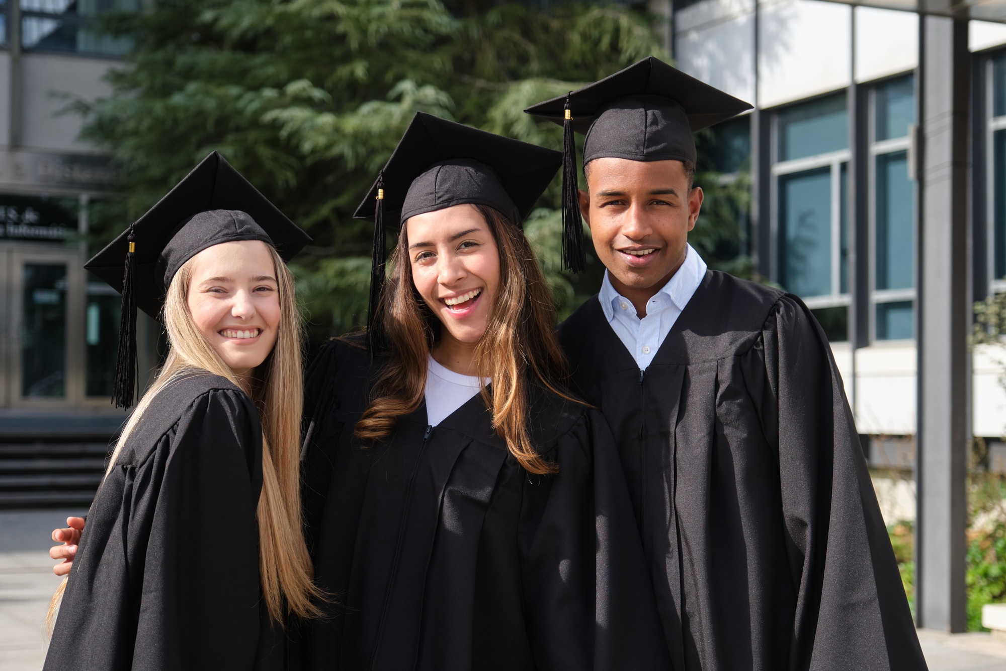 Happy college graduates celebrating their achievement